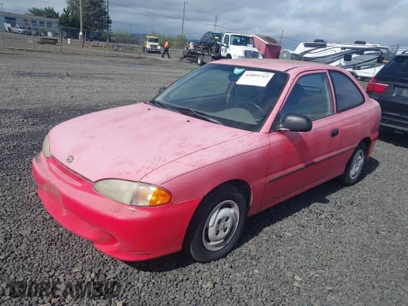1995 Hyundai Accent z VIN KMHVD14N9SU047038, wystawiony jako IAAI lot #41895712 z przebiegiem 186 094 mil mil oraz . Historia ofert i sprzedaży dostępna na DreamBid. Obrazek 2.