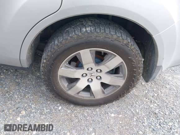 2014 Honda Pilot Touring with VIN 5FNYF4H97EB051760, listed as a IAAI auction lot 43329833 with 220,273 mi miles and . Bid and sale history available at DreamBid. Image 12.