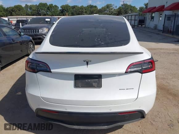 2022 Tesla Model Y Long Range z VIN 7SAYGDEEXNF353853, wystawiony jako IAAI lot #42792563 z przebiegiem 84 692 mil mil oraz . Historia ofert i sprzedaży dostępna na DreamBid. Obrazek 15.