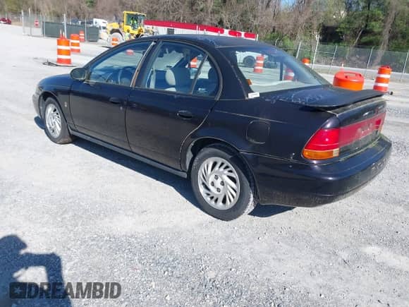 1999 Saturn SL z VIN 1G8ZK5274XZ333729, wystawiony jako IAAI lot #41987885 z przebiegiem Nie podano mil oraz . Historia ofert i sprzedaży dostępna na DreamBid. Obrazek 3.