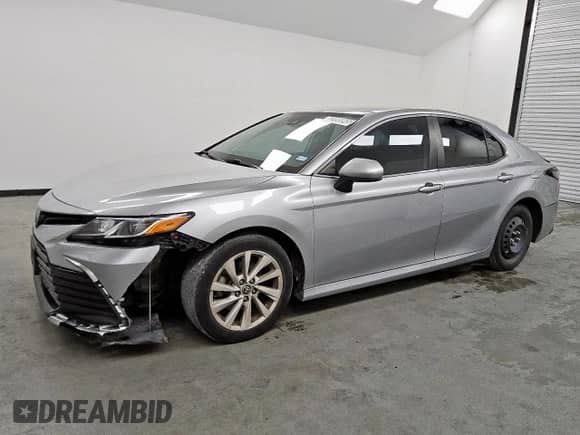 2022 Toyota Camry LE с VIN 4T1C11AK7NU665263, выставлен на аукционе Copart как лот 83995045 с пробегом 79 146 миль миль и Чистый • Clean title. История ставок и продаж доступна на DreamBid. Изображение 1.