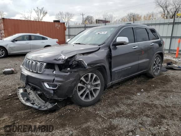 2017 Jeep Grand Cherokee Overland with VIN 1C4RJFCT0HC683423, listed as a Copart auction lot 52234715 with 106,857 mi miles and Salvage title. Bid and sale history available at DreamBid. Image 1.