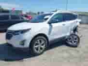2018 Chevrolet Equinox Premier with VIN 2GNAXMEV1J6338504, listed as a IAAI auction lot 43107226 with 129,549 mi miles and . Bid and sale history available at DreamBid. Image 2.