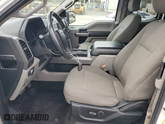 2018 Ford F-150 XL with VIN 1FTFX1E56JFB07584, listed as a Copart auction lot 84268845 with 70,649 mi miles and Salvage title. Bid and sale history available at DreamBid. Image 7.