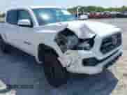 2018 Toyota Tacoma TRD Sport with VIN 3TMAZ5CN4JM063213, listed as a IAAI auction lot 43222181 with 82,040 mi miles and . Bid and sale history available at DreamBid. Image 6.