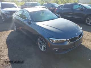 2019 BMW 4 Series 430i xDrive z VIN WBA4J3C56KBL10486, wystawiony jako IAAI lot #43197486 z przebiegiem 57 378 mil mil oraz . Historia ofert i sprzedaży dostępna na DreamBid. Obrazek 1.