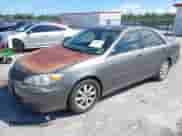 2002 Toyota Camry XLE with VIN JTDBF30K720021540, listed as a IAAI auction lot 43290459 with 259,537 mi miles and . Bid and sale history available at DreamBid. Image 2.