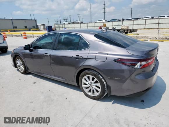 2021 Toyota Camry LE с VIN 4T1C11AK9MU587650, выставлен на аукционе Copart как лот 70694115 с пробегом 273 975 миль миль и Списание • Salvage title. История ставок и продаж доступна на DreamBid. Изображение 2.