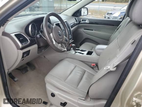 2012 Jeep Grand Cherokee Laredo z VIN 1C4RJFAG0CC156397, wystawiony jako Copart lot #87400775 z przebiegiem 165 192 mil mil oraz Szkoda całkowita • Salvage title. Historia ofert i sprzedaży dostępna na DreamBid. Obrazek 7.