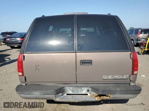 1997 Chevrolet Tahoe with VIN 1GNEK13R0VJ437926, listed as a Copart auction lot 62457605 with 115,603 mi miles and Clean title. Bid and sale history available at DreamBid. Image 6.