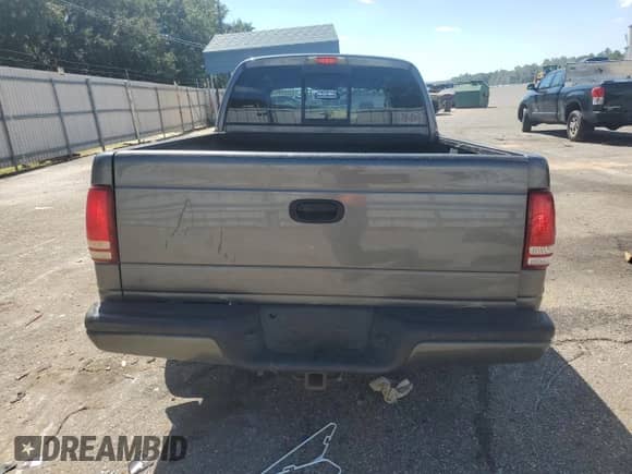 2003 Dodge Dakota Sport with VIN 1D7HL38N43S184708, listed as a Copart auction lot 73320964 with 143,398 mi miles and Salvage title. Bid and sale history available at DreamBid. Image 6.