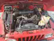 2000 Jeep Wrangler Sport z VIN 1J4FA49S6YP795653, wystawiony jako Copart lot #67831125 z przebiegiem 213 754 mil mil oraz Czysty tytuł • Clean title. Historia ofert i sprzedaży dostępna na DreamBid. Obrazek 11.