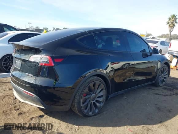 2022 Tesla Model Y Performance with VIN 7SAYGDEF7NF516418, listed as a IAAI auction lot 43222998 with 26,525 mi miles and . Bid and sale history available at DreamBid. Image 4.