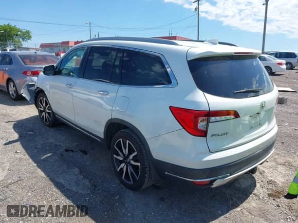 2020 Honda Pilot Touring 7-Passenger z VIN 5FNYF5H69LB000835, wystawiony jako IAAI lot #42318516 z przebiegiem 122 572 mil mil oraz . Historia ofert i sprzedaży dostępna na DreamBid. Obrazek 3.