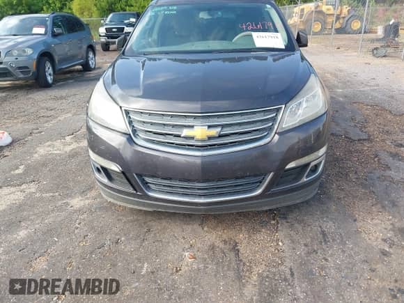 2013 Chevrolet Traverse LT z VIN 1GNKRGKDXDJ106308, wystawiony jako IAAI lot #42617918 z przebiegiem 80 823 mil mil oraz . Historia ofert i sprzedaży dostępna na DreamBid. Obrazek 6.