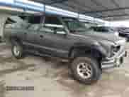 1993 Chevrolet Suburban z VIN 1GNFK16K7PJ392411, wystawiony jako Copart lot #43733375 z przebiegiem 245 702 mil mil oraz Szkoda całkowita • Salvage title. Historia ofert i sprzedaży dostępna na DreamBid. Obrazek 4.