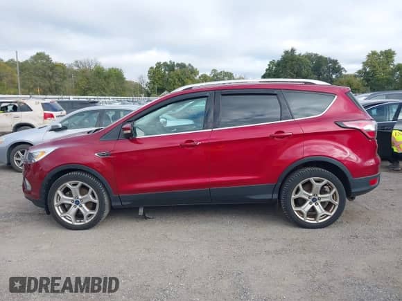 2017 Ford Escape Titanium with VIN 1FMCU9J97HUD48204, listed as a IAAI auction lot 43469125 with 118,239 mi miles and . Bid and sale history available at DreamBid. Image 14.