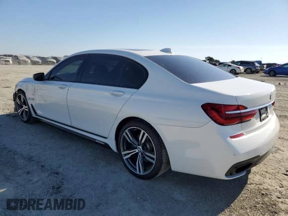 2018 BMW 7 Series 740i with VIN WBA7E2C55JG743312, listed as a Copart auction lot 70294775 with 98,385 mi miles and Salvage title. Bid and sale history available at DreamBid. Image 2.