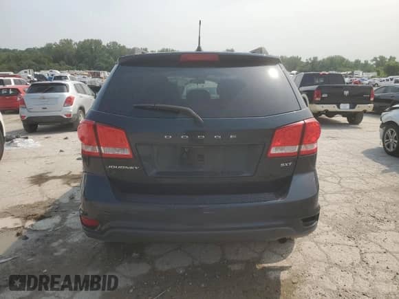 2014 Dodge Journey SXT with VIN 3C4PDCBBXET171609, listed as a Copart auction lot 67804315 with 127,593 mi miles and Salvage title. Bid and sale history available at DreamBid. Image 6.