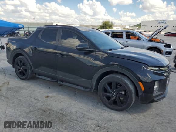 2023 Hyundai Santa Cruz Night Edition with VIN 5NTJCDAF6PH044900, listed as a Copart auction lot 61789325 with 34,520 mi miles and Salvage title. Bid and sale history available at DreamBid. Image 4.