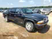 2004 Dodge Dakota Sport with VIN 1D7HL38K54S520454, listed as a Copart auction lot 64086085 with 225,994 mi miles and Salvage title. Bid and sale history available at DreamBid. Image 4.