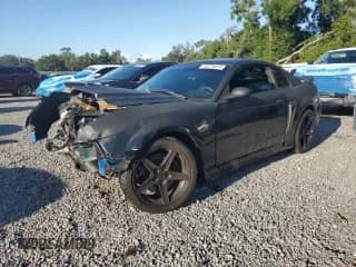2003 Ford Mustang GT Deluxe с VIN 1FAFP42X03F321034, выставлен на аукционе Copart как лот 69774975 с пробегом Не указан миль и Списание • Salvage title. История ставок и продаж доступна на DreamBid. Изображение 1.