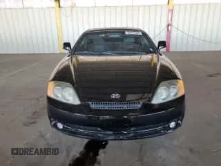 2003 Hyundai Tiburon GT с VIN KMHHN65F23U021493, выставлен на аукционе Copart как лот 68441584 с пробегом 92 848 миль миль и Чистый • Clean title. История ставок и продаж доступна на DreamBid. Изображение 5.