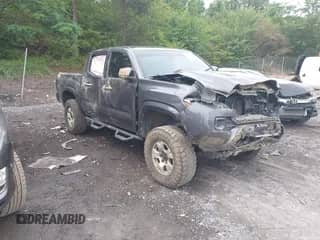 2019 Toyota Tacoma SR with VIN 3TMCZ5AN3KM197613, listed as a IAAI auction lot 42220660 with 95,789 mi miles and . Bid and sale history available at DreamBid. Image 1.