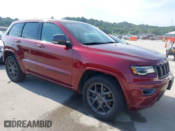 2021 Jeep Grand Cherokee 80th Anniversary z VIN 1C4RJFBG9MC652993, wystawiony jako IAAI lot #42582621 z przebiegiem 65 873 mil mil oraz . Historia ofert i sprzedaży dostępna na DreamBid. Obrazek 1.