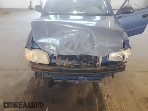 2000 Hyundai Accent z VIN KMHCG45G6YU066218, wystawiony jako Copart lot #84948715 z przebiegiem 110 059 mil mil oraz Szkoda całkowita • Salvage title. Historia ofert i sprzedaży dostępna na DreamBid. Obrazek 11.