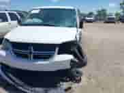 2014 Dodge Grand Caravan SE with VIN 2C4RDGBG0ER450775, listed as a IAAI auction lot 42589472 with 11 mi miles and . Bid and sale history available at DreamBid. Image 2.