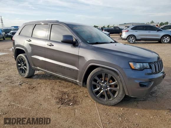 2018 Jeep Grand Cherokee Laredo E with VIN 1C4RJEAG0JC322747, listed as a Copart auction lot 60547435 with 109,935 mi miles and Salvage title. Bid and sale history available at DreamBid. Image 4.
