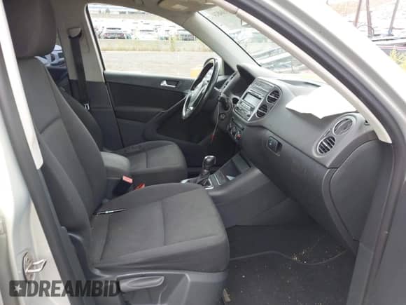 2013 Volkswagen Tiguan S with VIN WVGBV3AXXDW580007, listed as a IAAI auction lot 43104824 with 203,479 mi miles and . Bid and sale history available at DreamBid. Image 5.