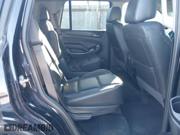 2018 Chevrolet Tahoe Premier with VIN 1GNSKCKC4JR245996, listed as a IAAI auction lot 41195858 with 98,823 mi miles and . Bid and sale history available at DreamBid. Image 8.