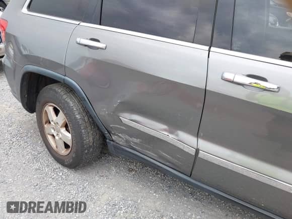 2012 Jeep Grand Cherokee Laredo with VIN 1C4RJFAG3CC272631, listed as a IAAI auction lot 43291923 with 168,220 mi miles and . Bid and sale history available at DreamBid. Image 6.