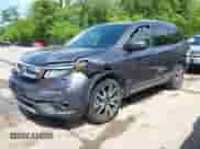 2021 Honda Pilot Touring 7-Passenger with VIN 5FNYF6H66MB081767, listed as a IAAI auction lot 42221152 with 74,029 mi miles and . Bid and sale history available at DreamBid. Image 2.