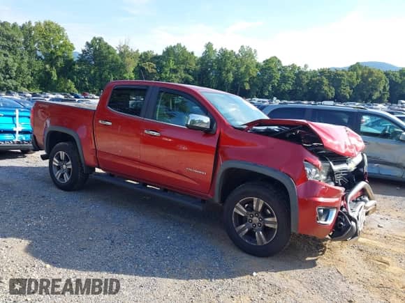 2015 Chevrolet Colorado 4WD LT z VIN 1GCGTBE31F1184744, wystawiony jako IAAI lot #42988122 z przebiegiem 122 987 mil mil oraz . Historia ofert i sprzedaży dostępna na DreamBid. Obrazek 1.