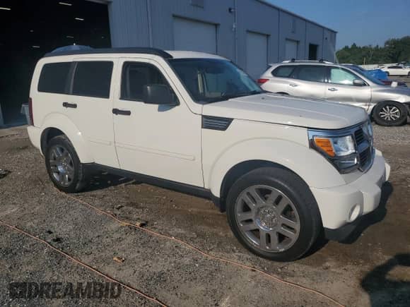 2007 Dodge Nitro SLT with VIN 1D8GU58K47W735000, listed as a Copart auction lot 69184345 with 157,753 mi miles and Salvage title. Bid and sale history available at DreamBid. Image 4.