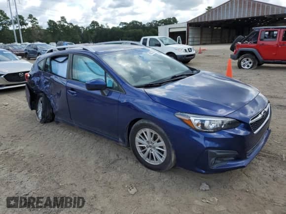 2018 Subaru Impreza Premium with VIN 4S3GTAD62J3714075, listed as a Copart auction lot 68227595 with 148,222 mi miles and Salvage title. Bid and sale history available at DreamBid. Image 4.