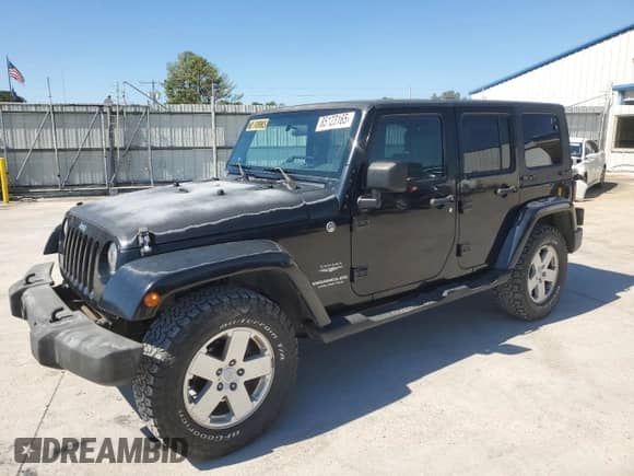 2007 Jeep Wrangler Unlimited Sahara z VIN 1J4GA59127L152918, wystawiony jako Copart lot #85123165 z przebiegiem 180 573 mil mil oraz Szkoda całkowita • Salvage title. Historia ofert i sprzedaży dostępna na DreamBid. Obrazek 1.