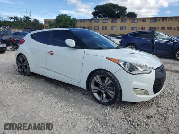 2014 Hyundai Veloster z VIN KMHTC6AD4EU194875, wystawiony jako Copart lot #84427235 z przebiegiem 127 813 mil mil oraz Szkoda całkowita • Salvage title. Historia ofert i sprzedaży dostępna na DreamBid. Obrazek 4.