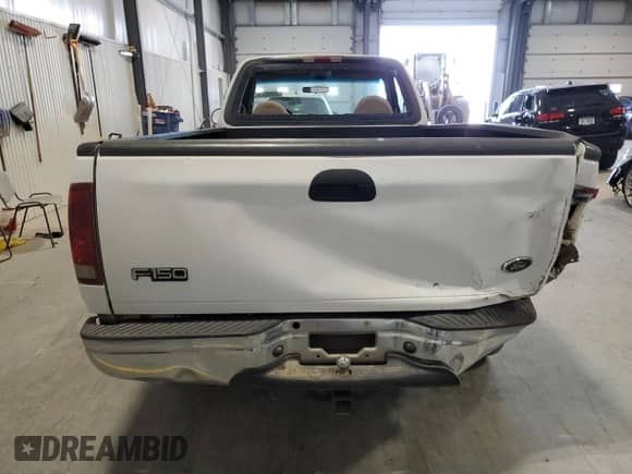 2001 Ford F-150 XL with VIN 1FTRF17W31NA23928, listed as a Copart auction lot 42345325 with 164,319 mi miles and Salvage title. Bid and sale history available at DreamBid. Image 6.