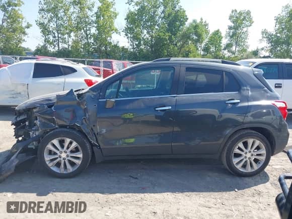 2018 Chevrolet Trax Premier with VIN 3GNCJMSB0JL290008, listed as a IAAI auction lot 43003407 with 113,095 mi miles and . Bid and sale history available at DreamBid. Image 14.