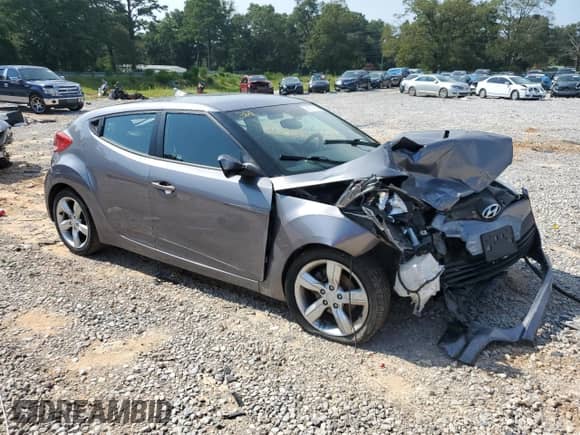 2012 Hyundai Veloster w/Black Int z VIN KMHTC6AD7CU028864, wystawiony jako Copart lot #66377895 z przebiegiem 130 440 mil mil oraz Szkoda całkowita • Salvage title. Historia ofert i sprzedaży dostępna na DreamBid. Obrazek 4.