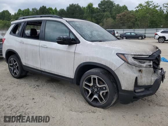 2023 Honda Passport Elite с VIN 5FNYF8H06PB022732, выставлен на аукционе Copart как лот 56893845 с пробегом 33 620 миль миль и Списание • Salvage title. История ставок и продаж доступна на DreamBid. Изображение 4.