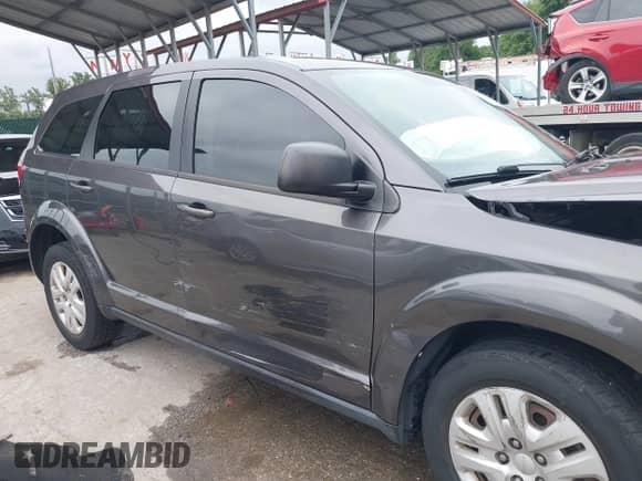 2014 Dodge Journey American Value with VIN 3C4PDCAB3ET285663, listed as a IAAI auction lot 42894235 with 117,285 mi miles and . Bid and sale history available at DreamBid. Image 18.