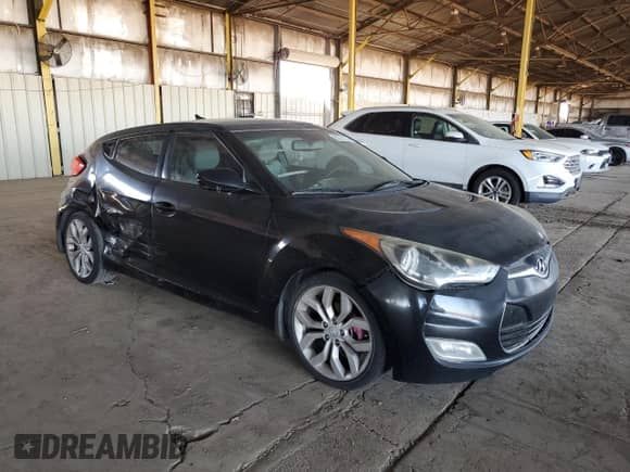 2013 Hyundai Veloster w/Gray Int z VIN KMHTC6AD1DU157409, wystawiony jako Copart lot #85374155 z przebiegiem 151 297 mil mil oraz Szkoda całkowita • Salvage title. Historia ofert i sprzedaży dostępna na DreamBid. Obrazek 4.