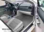 2014 Toyota Camry LE z VIN 4T1BD1FK0EU136281, wystawiony jako IAAI lot #42273197 z przebiegiem 112 961 mil mil oraz . Historia ofert i sprzedaży dostępna na DreamBid. Obrazek 5.