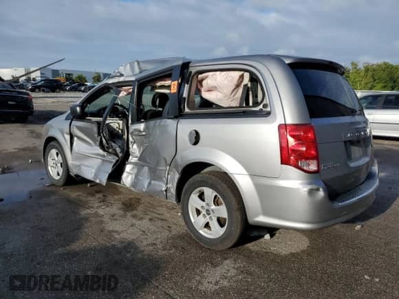 2017 Dodge Grand Caravan SE with VIN 2C4RDGBG2HR624852, listed as a Copart auction lot 84373115 with 141,702 mi miles and Salvage title. Bid and sale history available at DreamBid. Image 2.