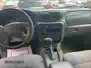 2003 Chevrolet TrailBlazer EXT LT z VIN 1GNET16S136172543, wystawiony jako Copart lot #71079825 z przebiegiem 193 815 mil mil oraz Czysty tytuł • Clean title. Historia ofert i sprzedaży dostępna na DreamBid. Obrazek 9.